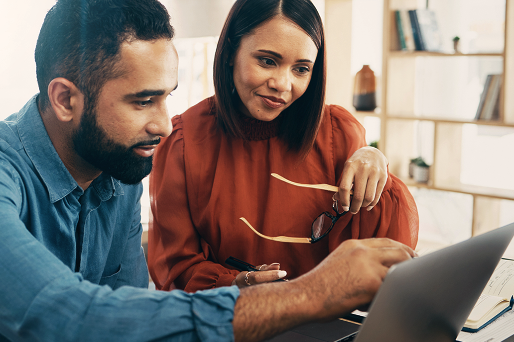 Image of two colleagues working together